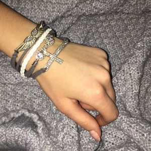 Wings and cross bracelet.